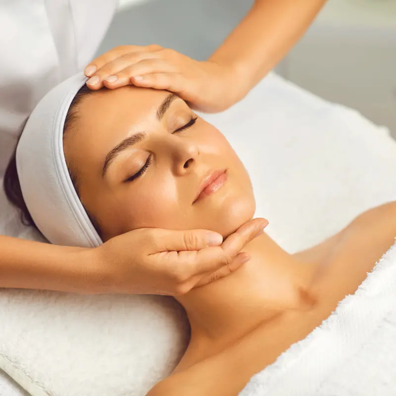 Client receiving relaxing facial treatment